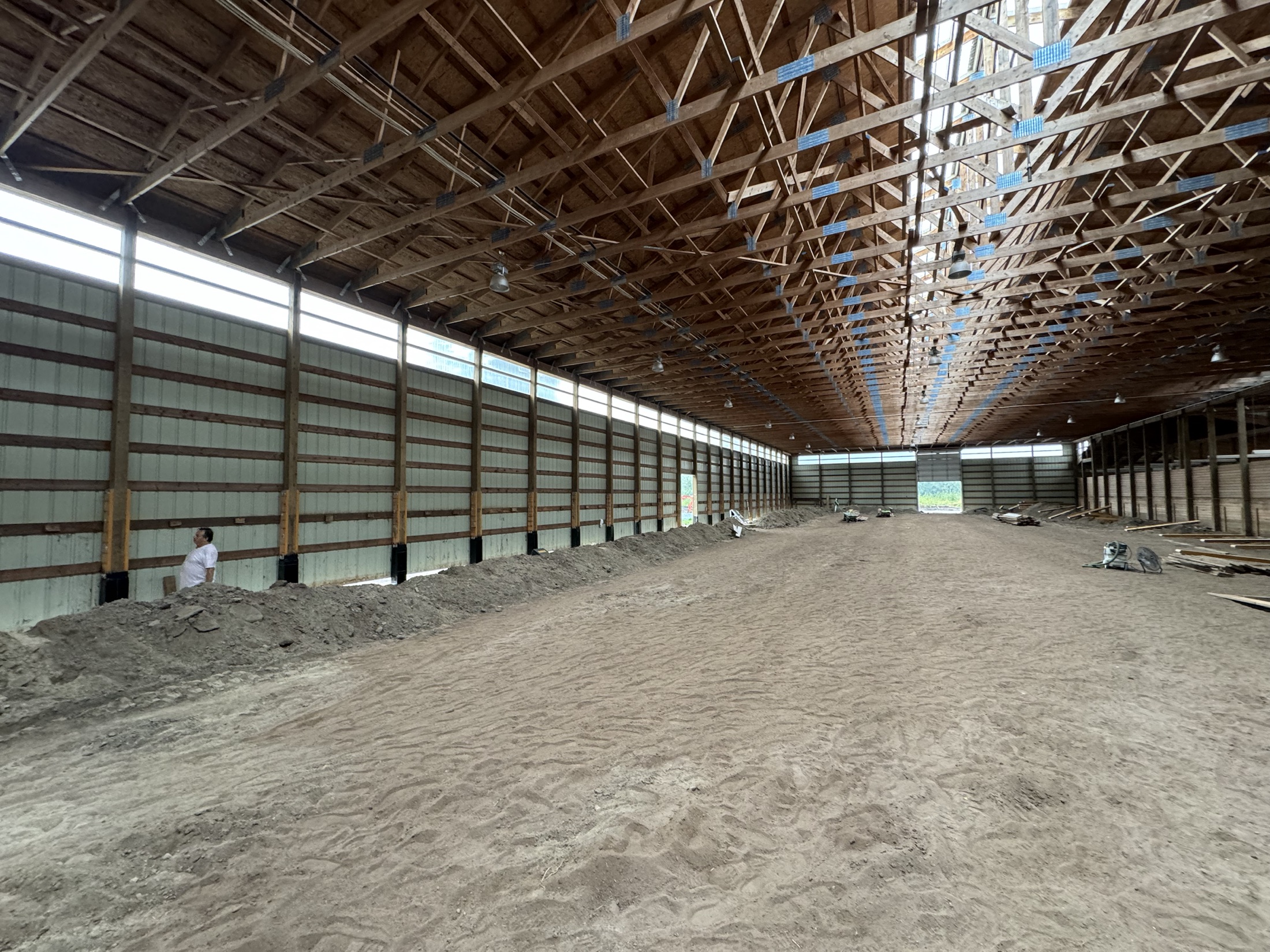 New pressure-treated post framing in place after rotten post replacement at Coast Performance Horses, Langley, ahead of kick wall cladding