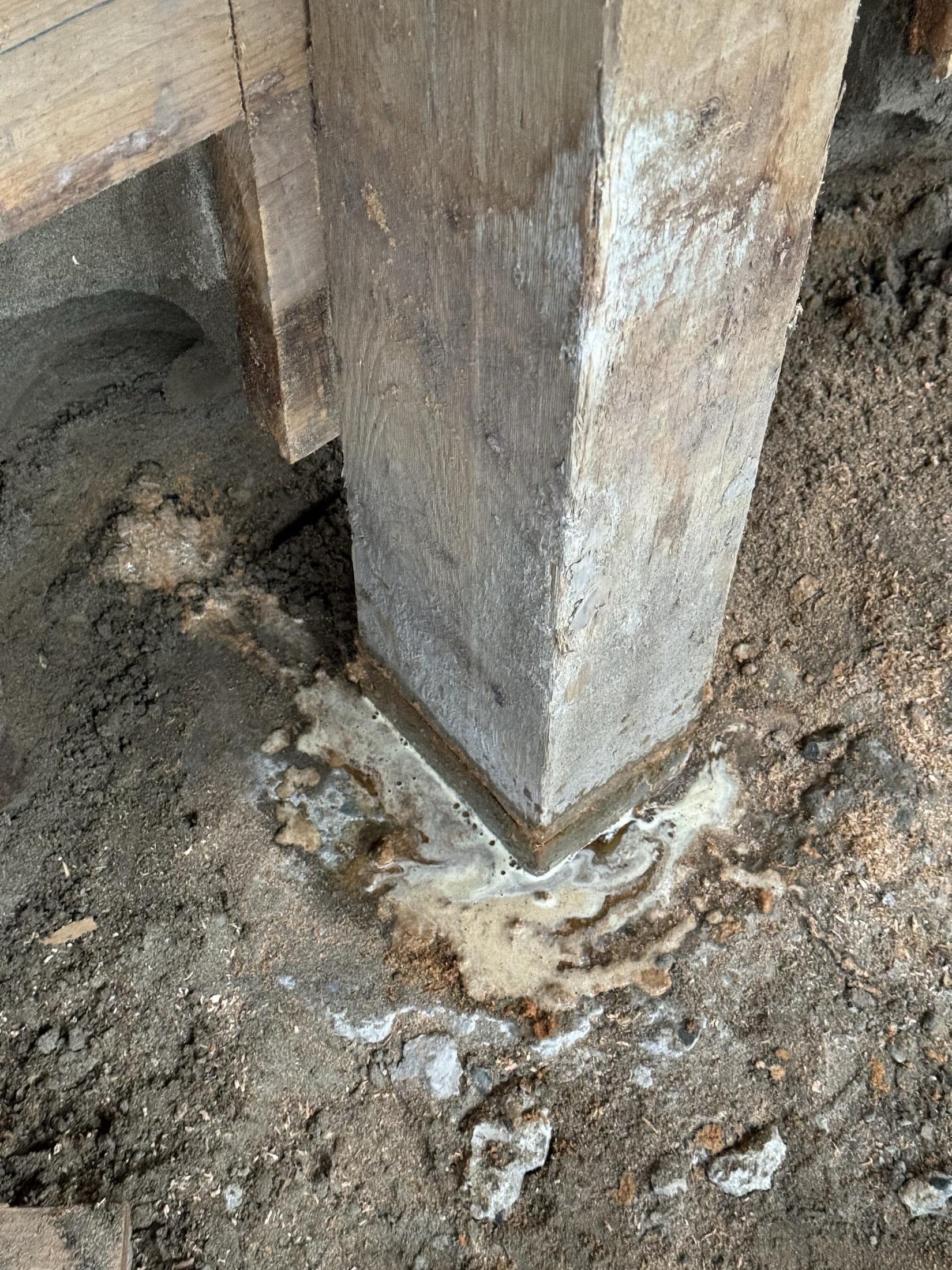 Rot detail at a structural post base at Coast Performance Horses, Langley