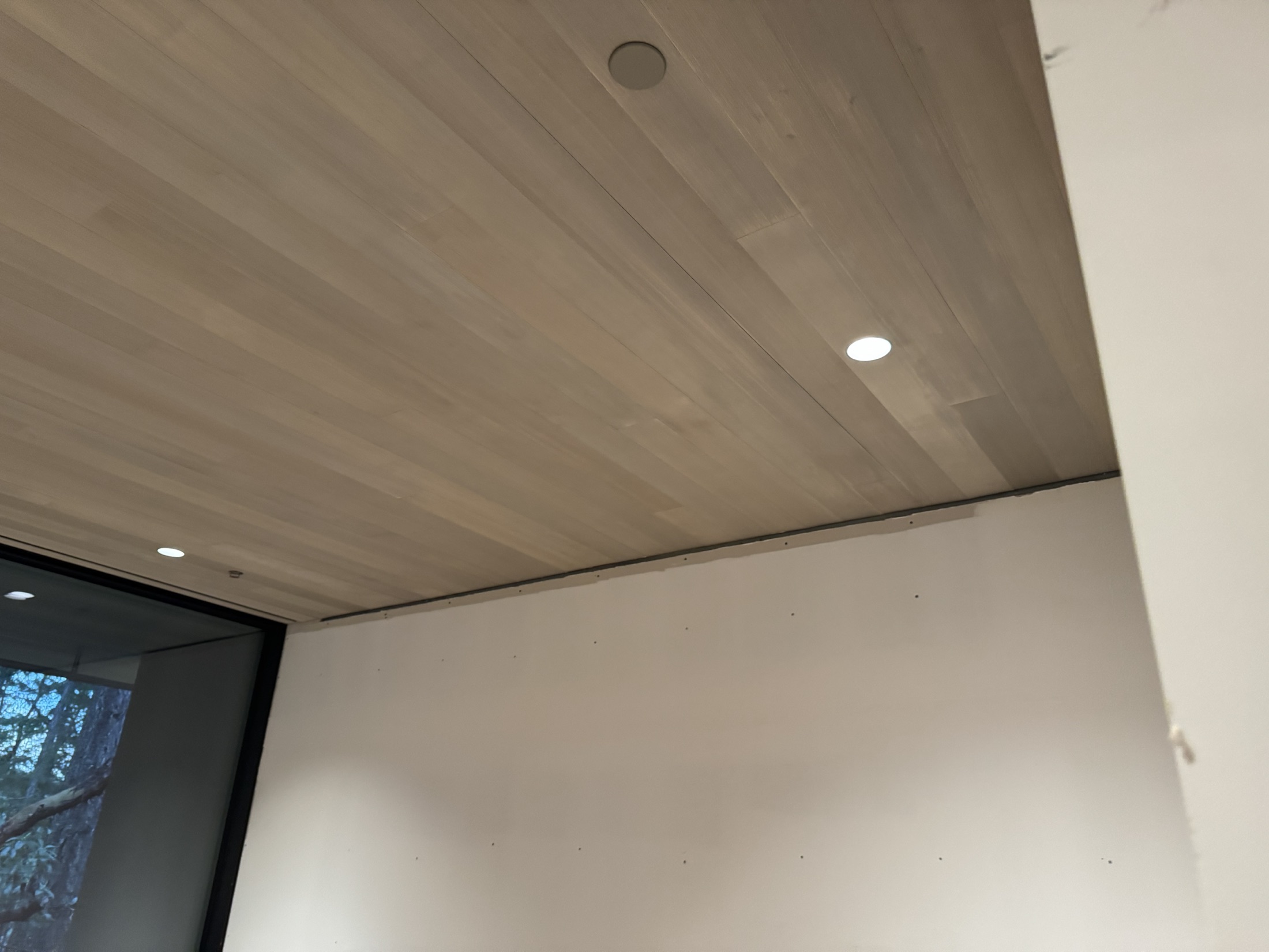 Finished hemlock plank ceiling with recessed lighting at the Cove Beach custom home, Sechelt