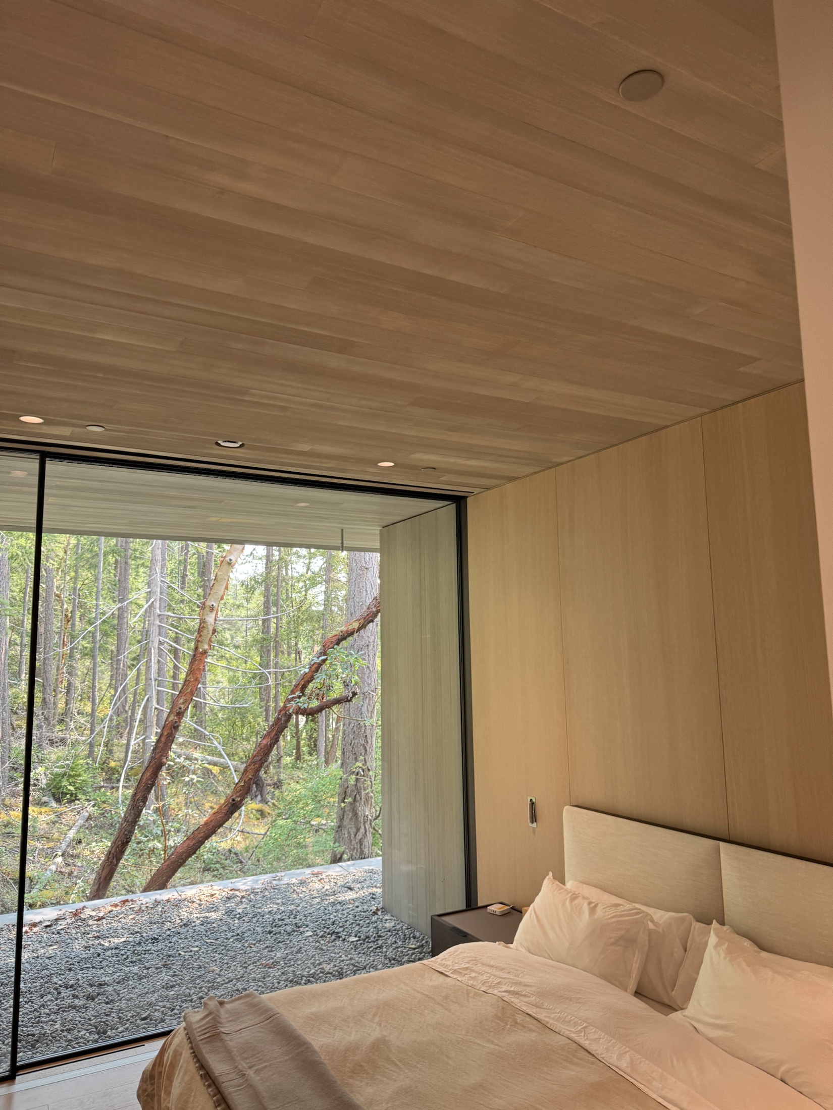 Finished hemlock ceiling and full-height glazing at the Cove Beach custom home, Sechelt