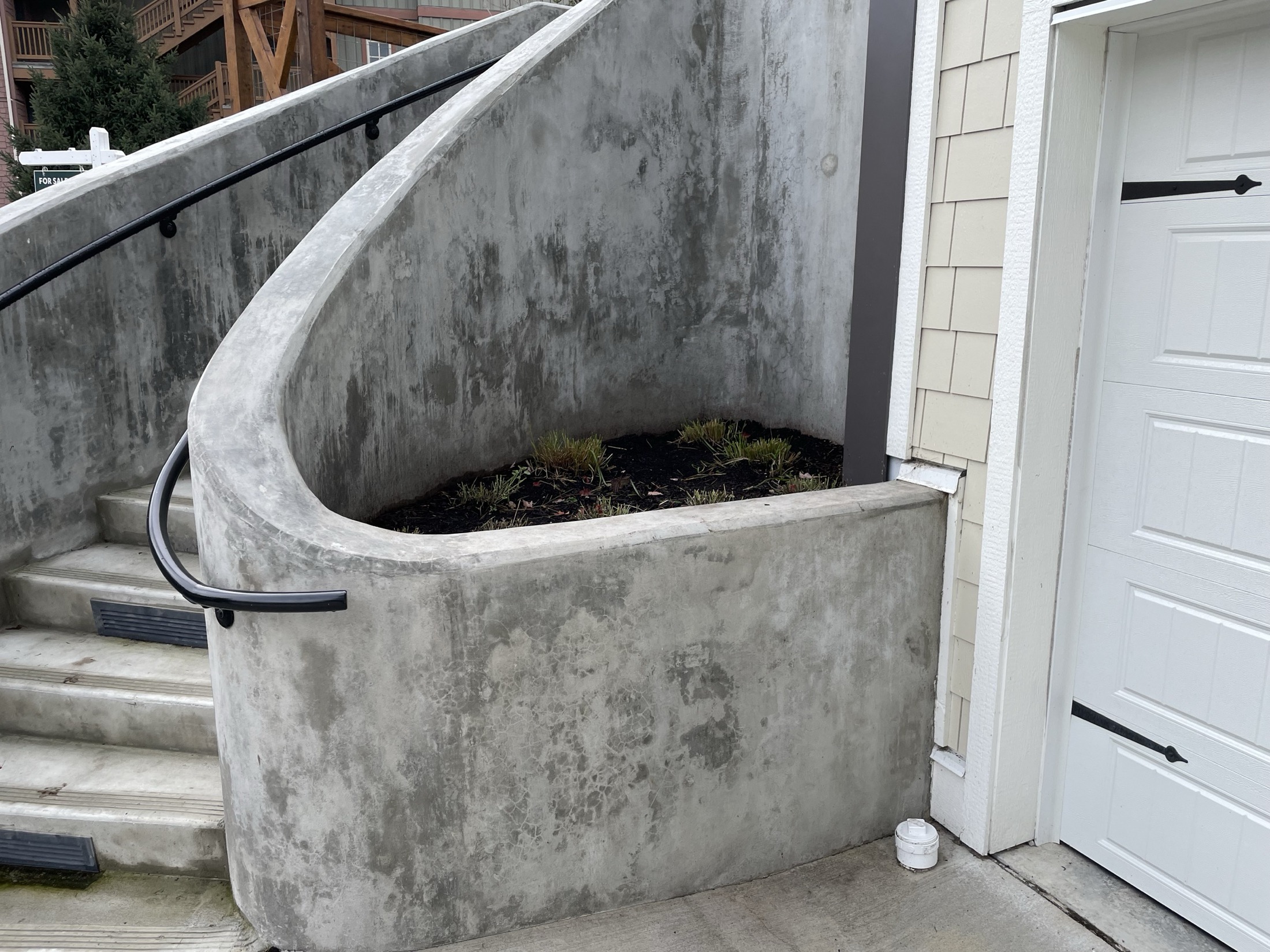 Finished curved cast-in-place concrete stairwell on a Pemberton townhouse development