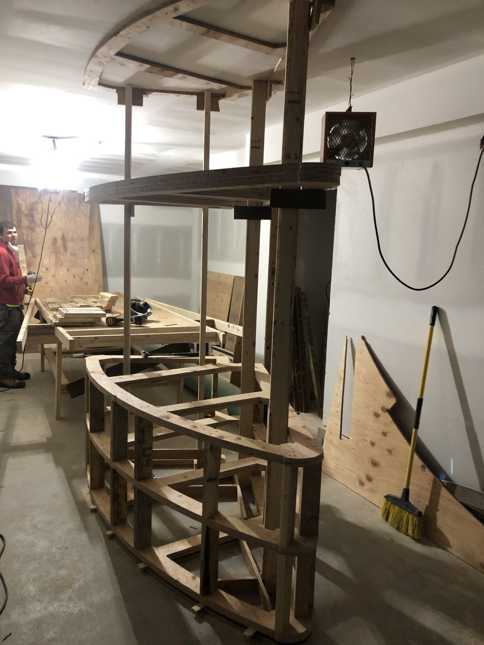 Curved plywood stair formwork under construction in-shop for the Pemberton curved concrete staircase